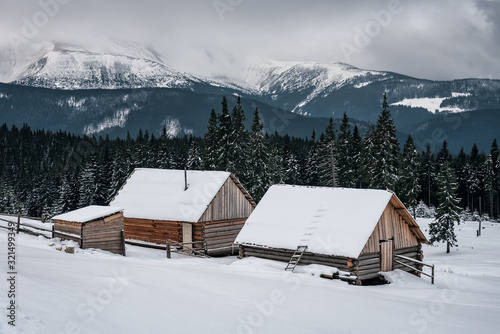 abandoned cabins in snowy winter mountains © Volodymyr Shevchuk