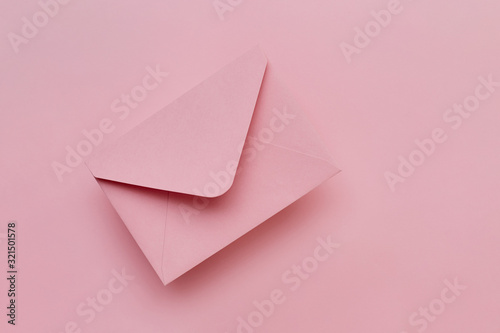 Pink envelope on the pink background. Mail concept
