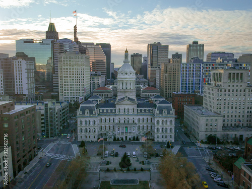 Aerial View of Downtown Baltimore  Maryland at Sunset on a Fall Evening - with City Hall in center frame and Various buildings and Skyscrapers in the background