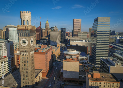 Aerial View of Downtown Baltimore Maryland on a Sunny Fall Afternoon - with the Seltzer Arts Clock Tower and Various Buildings and Skyscrapers in the Frame photo