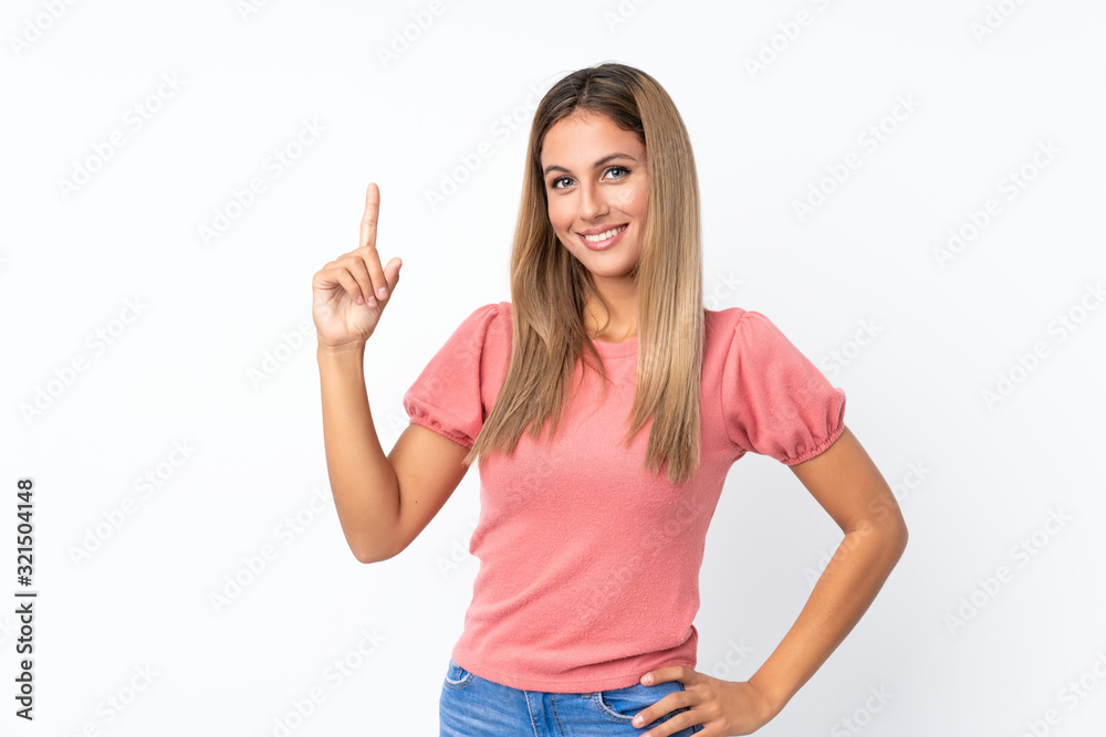 Young blonde woman over isolated white background showing and lifting a finger in sign of the best Young blonde woman over isolated white background showing and lifting a finger in sign of the best