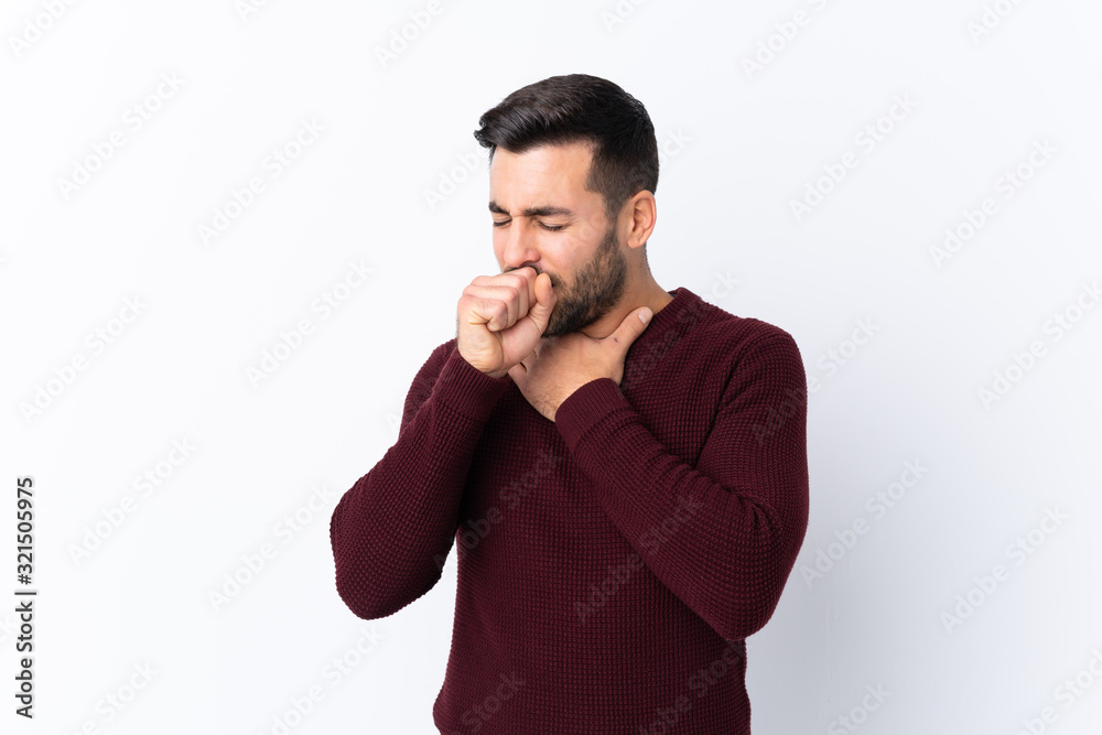 Young handsome man with beard over isolated white background is suffering with cough and feeling bad Young handsome man with beard over isolated white background is suffering with cough and feeling bad