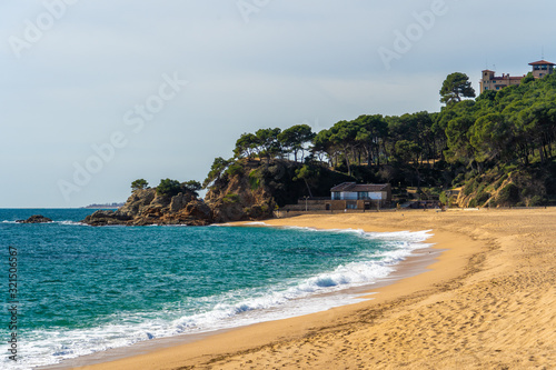 Fenals beach in Lloret de Mar, Costa Brava de Griona, without people, promenade of the sea photo