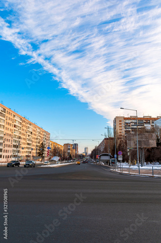 Morning street with cars of a small provincial city