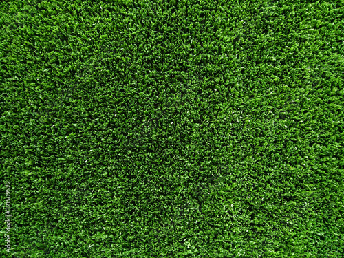 Artificial green grass texture background.