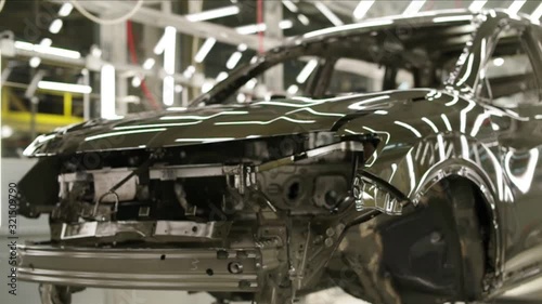 Wallpaper Mural the car body painted in green moves along the conveyor. Torontodigital.ca