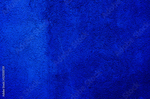 Blue colored abstract wall background with textures of different shades of blue