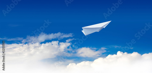 Paper plane in the blue sky.