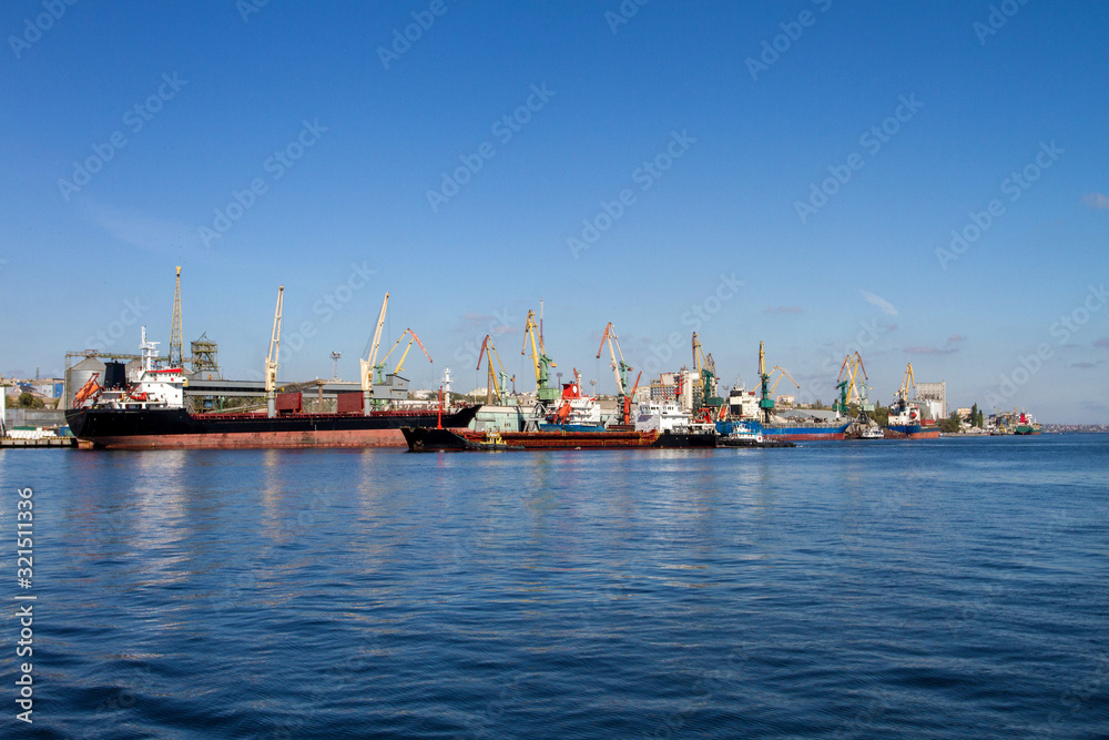 sea ships loading tower cranes in port