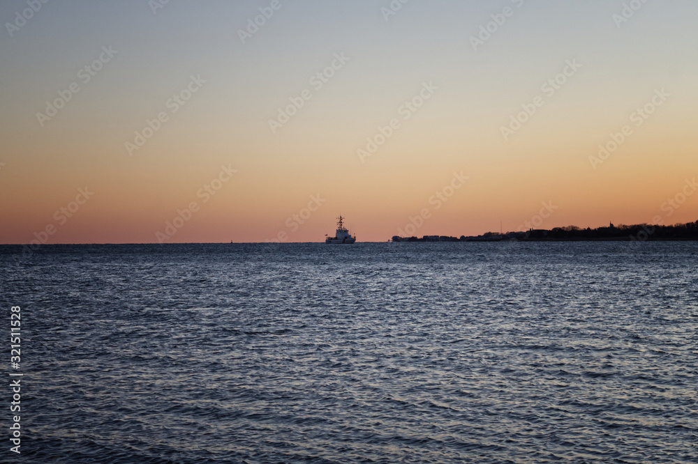 Boat in the sunset in Marion Harbor 
