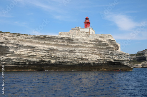 Cliffed Coast and red lighthouse near Bonifacio City in the Cors