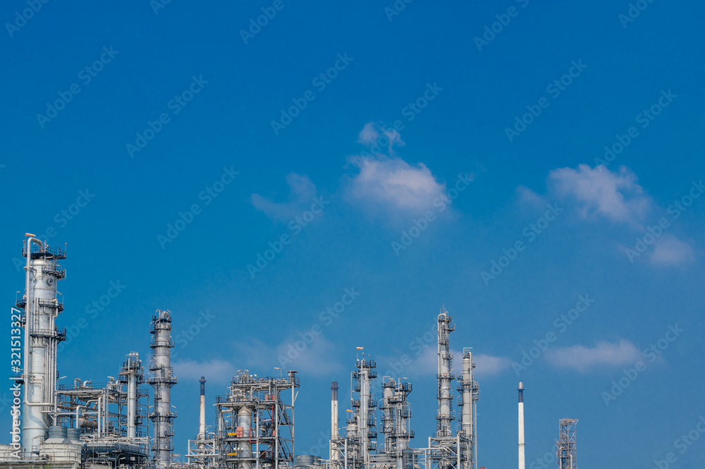 Fototapeta premium Industrial zone,The equipment of oil refining,Close-up of industrial pipelines of an oil-refinery plant,Detail of oil pipeline with valves in large oil refinery.