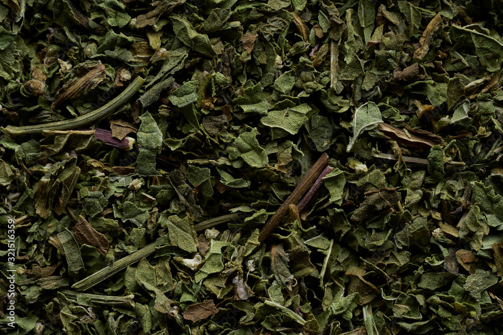 A scattering of elite green tea on a white background A scattering of elite green tea on a white background