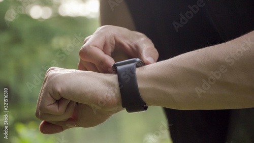 Making various gestures with a finger on a touch screen of a smart watch wearable device.