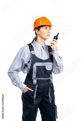 Female construction engineer talking on walkie-talkie with workers. Isolated
