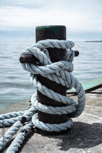 Boat cleat rope tie on dock - large cruise ship