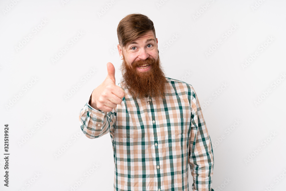 Redhead man with long beard over isolated white background with thumbs up because something good has happened Redhead man with long beard over isolated white background with thumbs up because something good has happened