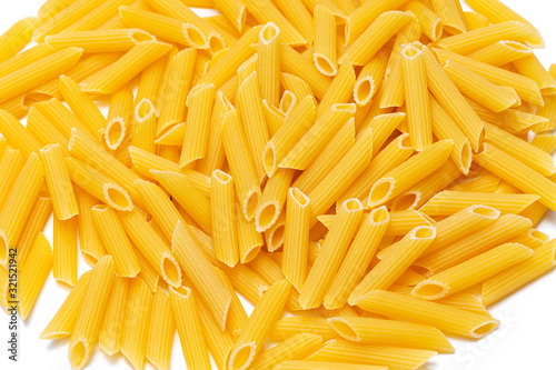 yellow Italian pasta made from durum wheat on a white background