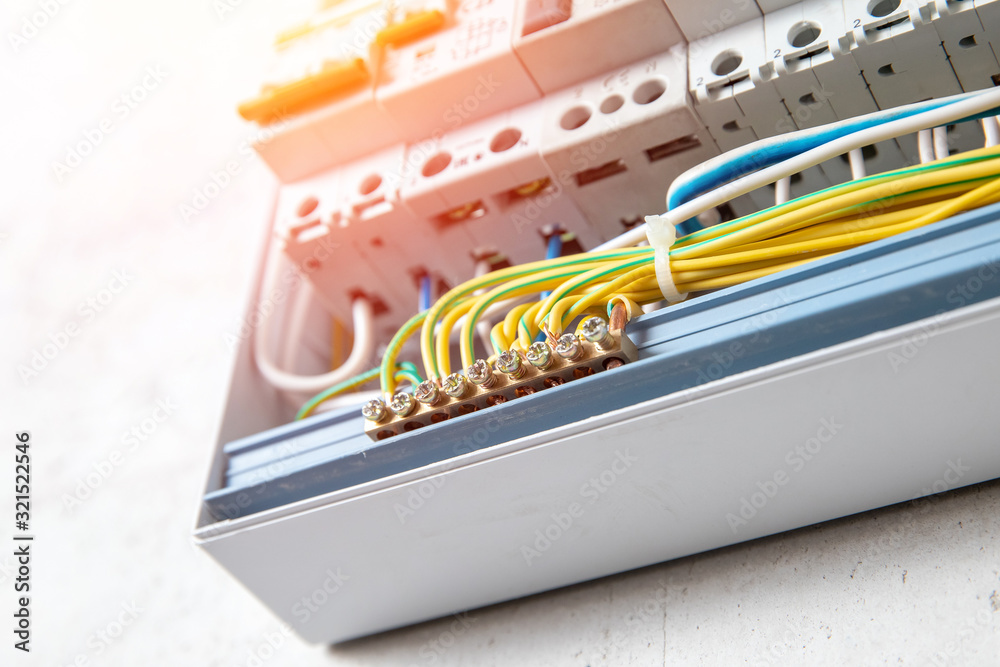 Close up elements copper wires consumer electric control panel switchboard enclosure for distribution and power electricity Close up elements copper wires consumer electric control panel switchboard enclosure for distribution and power electricity
