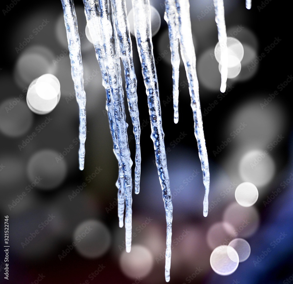 image of icicles melting on a sunny day image of icicles melting on a sunny day