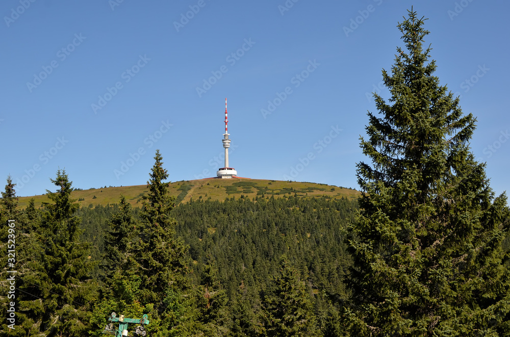 television tower on the hill praded in czech republic from distance