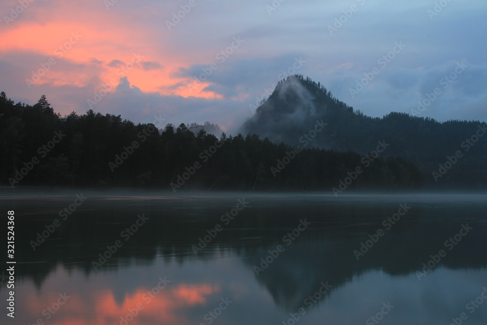 Altay, Katun river at sunset, mountain onion in the clouds