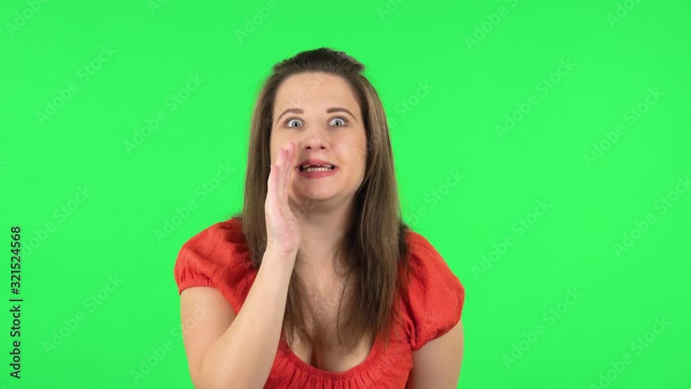 Portrait of cute girl showing gesture come here, covering her mouth with her hand and whispering the secret. Green screen Portrait of cute girl showing gesture come here, covering her mouth with her hand and whispering the secret. Green screen