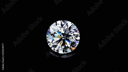 Natural big round diamond on a black background. Unique extreme close up shooting. The footage is created from a raw sequence and can be changed for any technical requirements.