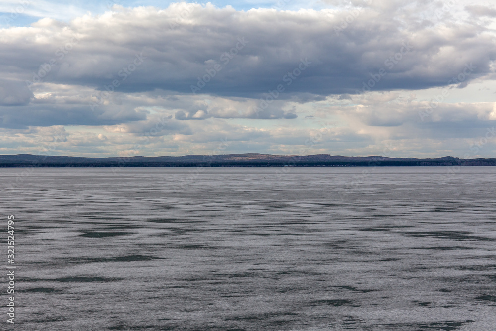 Spring nature. Melting ice on rivers and lakes. Sunny day in Siberia. selective focus Spring nature. Melting ice on rivers and lakes. Sunny day in Siberia. selective focus