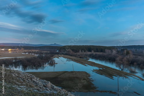 view from the cliff to the Russian village at night. Russia. long shutter speed. selective focus