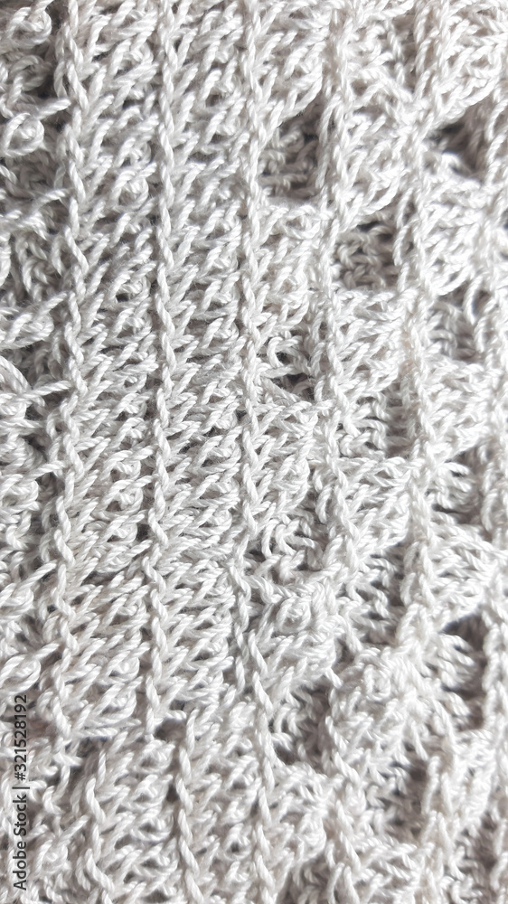 Light coloured knitted texture, fiber photo background. Fashion pattern modern, backdrop surface empty color Light coloured knitted texture, fiber photo background. Fashion pattern modern, backdrop surface empty color