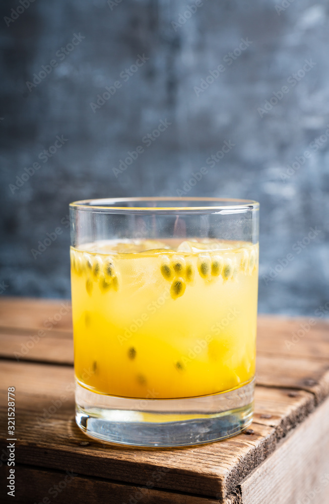 Old fahioned passion fruit cocktail on the rustic background. Selective focus. Shallow depth of field. Old fahioned passion fruit cocktail on the rustic background. Selective focus. Shallow depth of field.