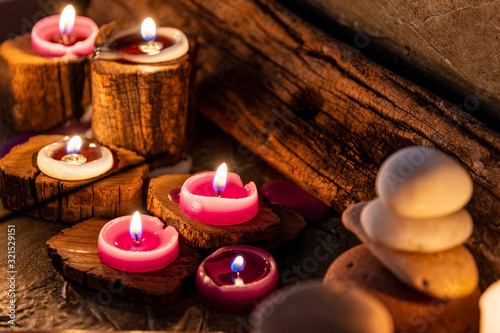  burning candles with ornate wood photo