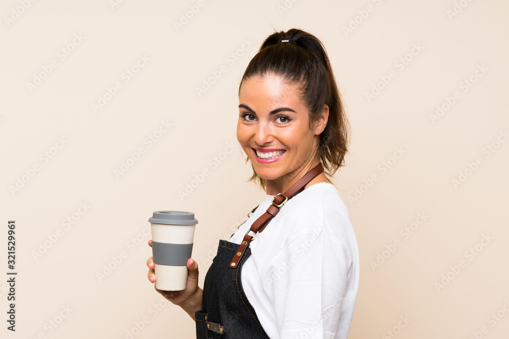 Young employee woman holding a take away coffee smiling a lot Young employee woman holding a take away coffee smiling a lot