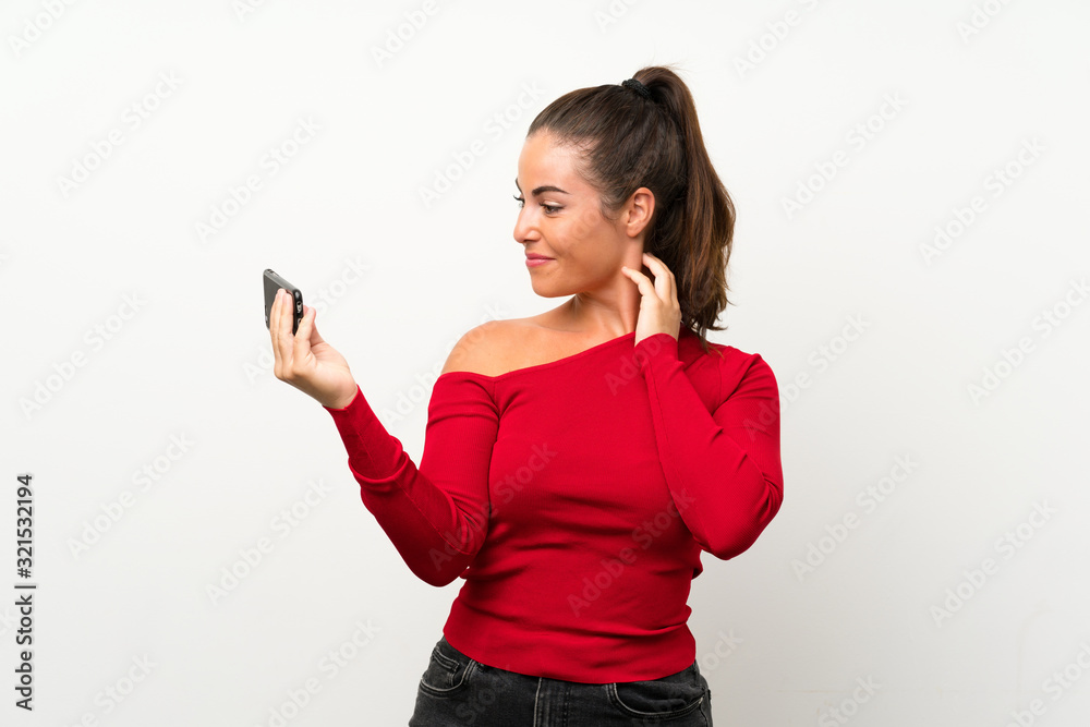 Young woman taking a selfie with the mobile Young woman taking a selfie with the mobile