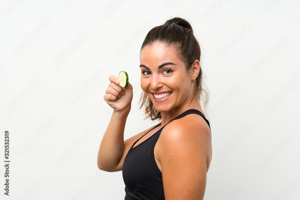 Beautiful young woman holding slices of cucumber Beautiful young woman holding slices of cucumber