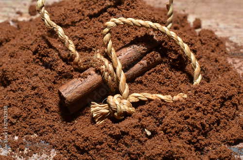 Decoration of coffee and cinnamon as well as ropes from woven rattan candles (Calamus javensis), a type of rattan used for rigging, various types of crafts. The color is rather brown. photo