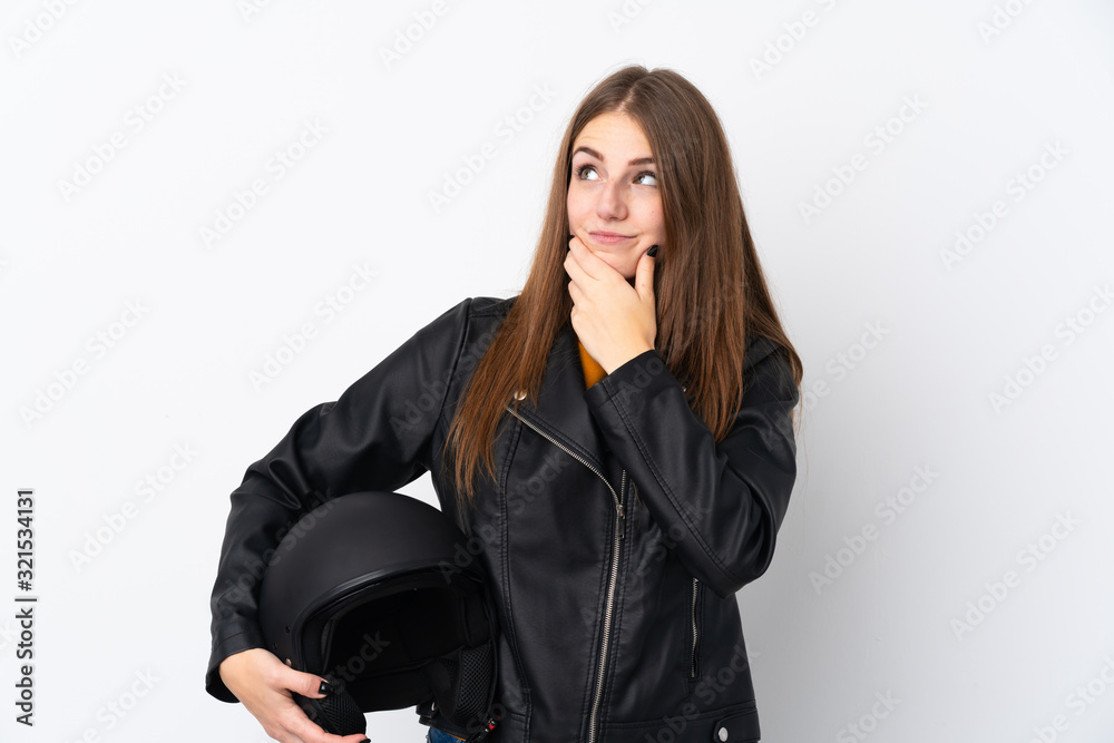Woman with a motorcycle helmet thinking an idea Woman with a motorcycle helmet thinking an idea