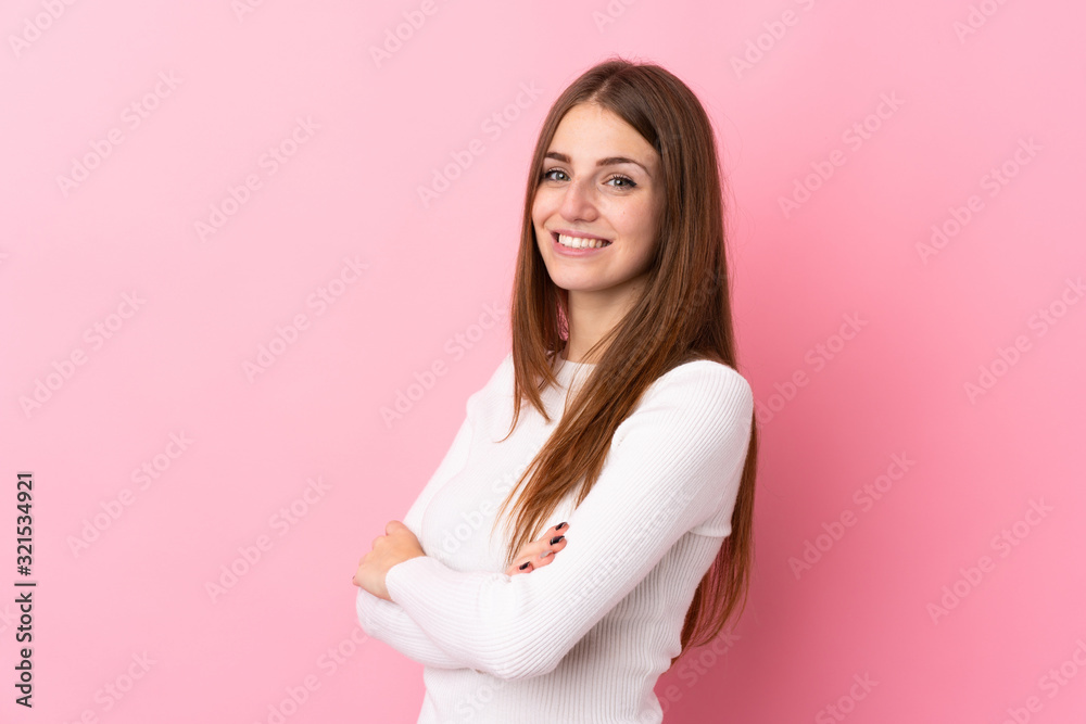 Young woman over isolated pink background with arms crossed and looking forward Young woman over isolated pink background with arms crossed and looking forward