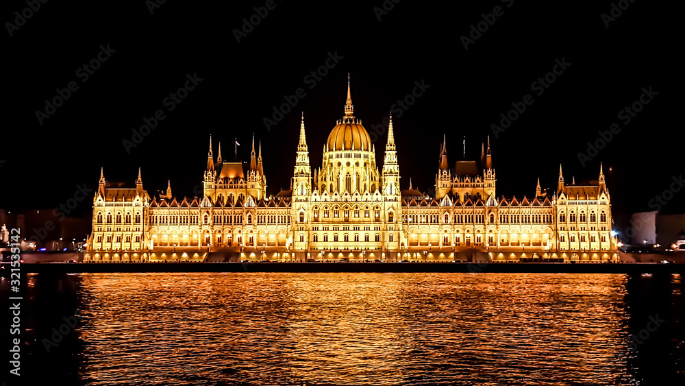 Fototapeta premium Budapest Parliament in Hungary at night. View form the Danube river.