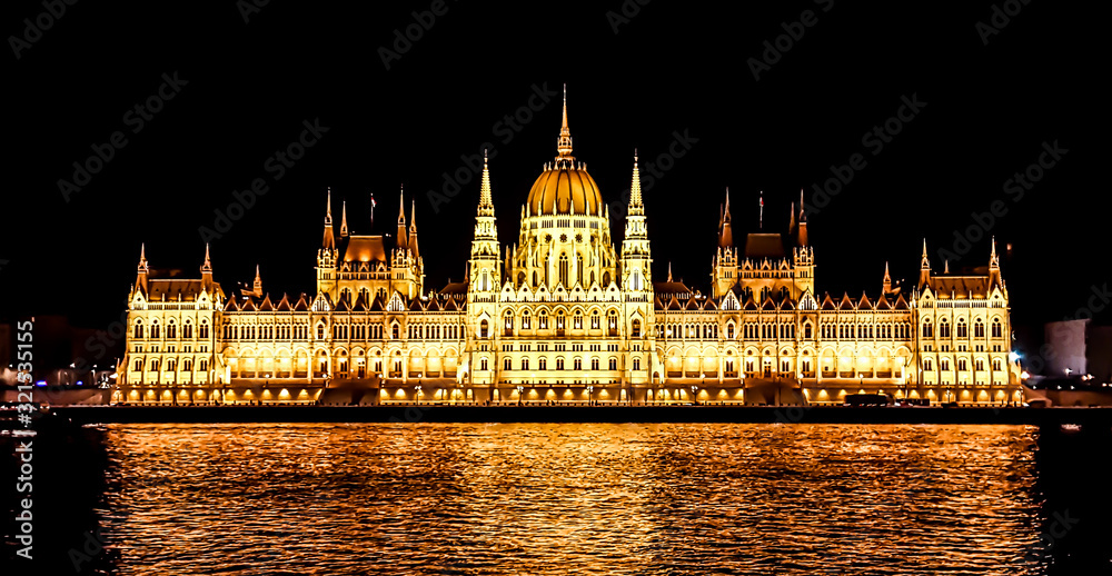 Budapest Parliament in Hungary at night. View form the Danube river.