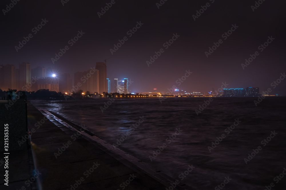Night embankment. City quay landscape in Weihai.