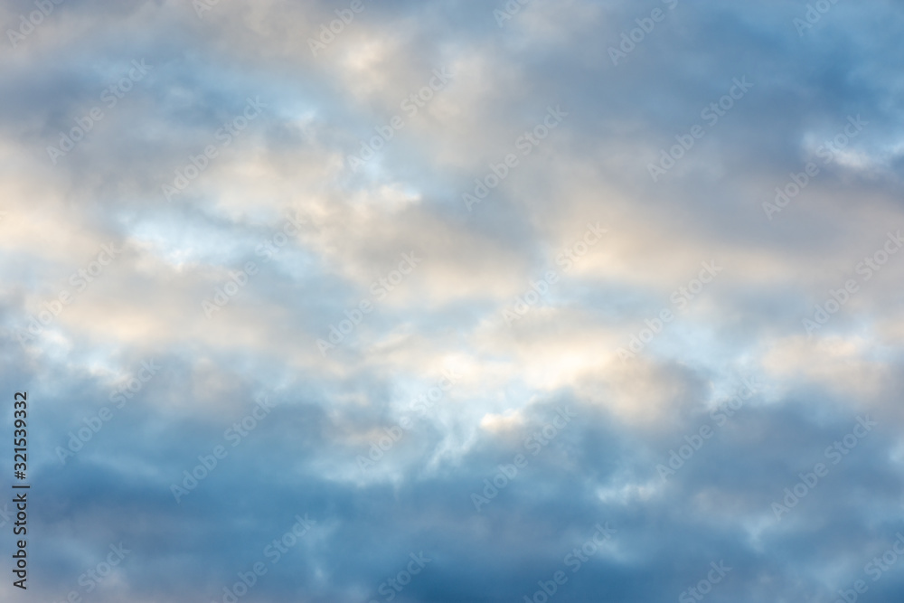 texture of the sky clouds and rays of sun on a background texture of the sky clouds and rays of sun on a background