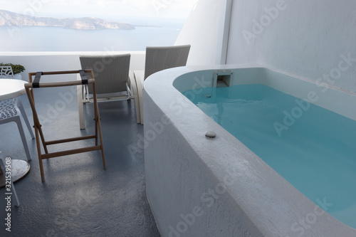 hotels with Jacuzzi and Caldera views in the famous white cave houses of the most romantic and beautiful island of Santorini in Greece