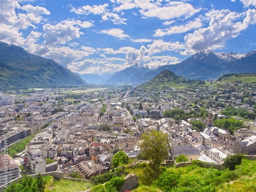 Panoramic view over the city of Sion (Sitten) and into the magnificent Rhone Valley embedded into the Swiss Alps with the Mont D'Ogre to the right