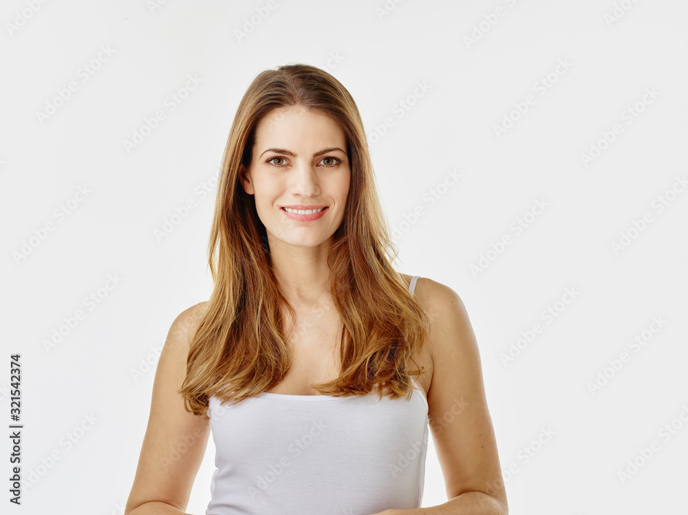Portrait of smiling woman with long hair against white background Portrait of smiling woman with long hair against white background