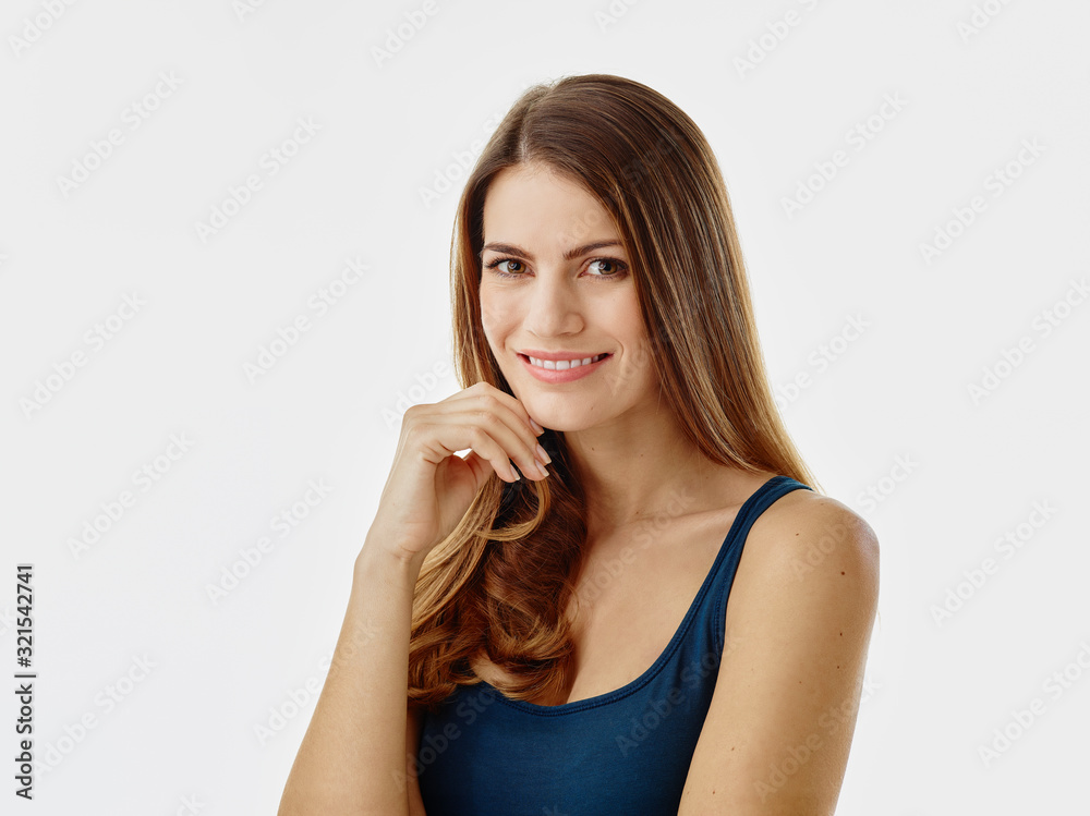Portrait of smiling woman with long hair against white background Portrait of smiling woman with long hair against white background