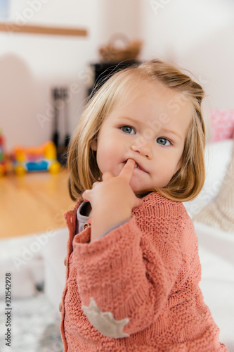 Portrait of little girl at home photo