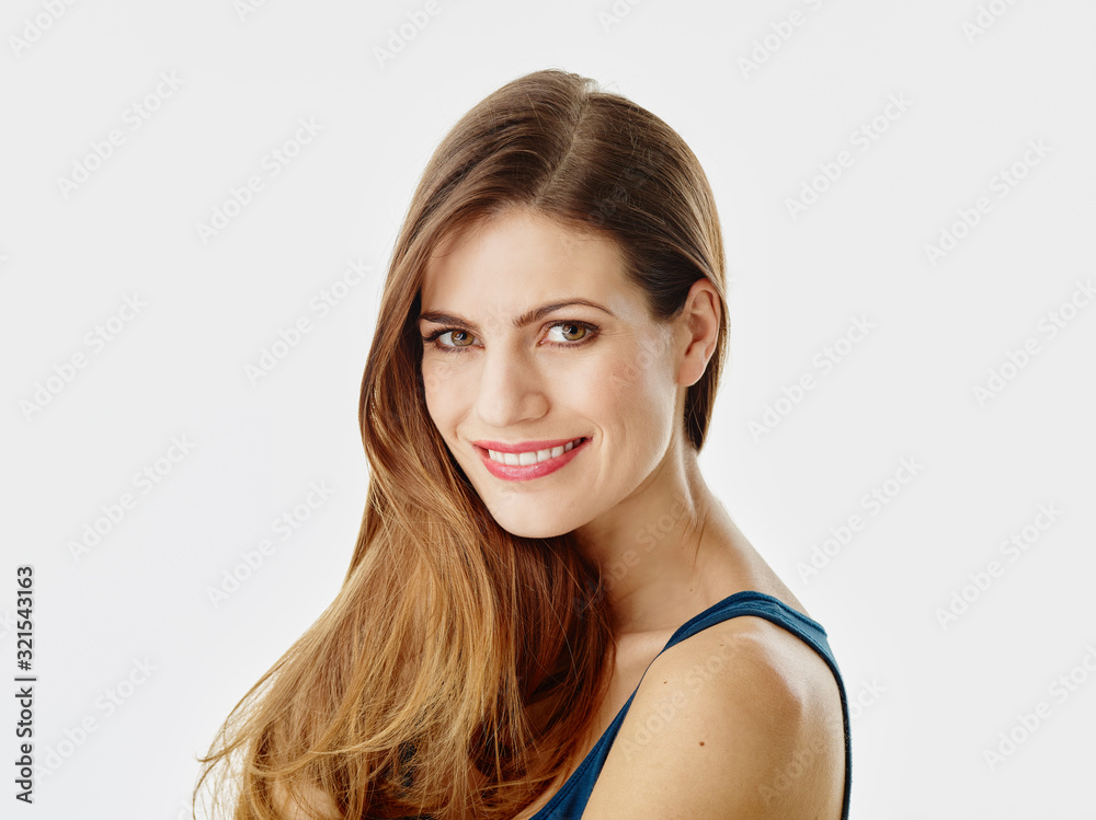 Portrait of smiling woman with long hair against white background Portrait of smiling woman with long hair against white background