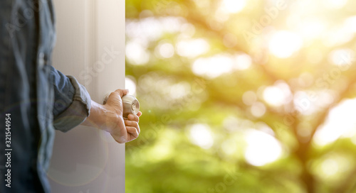 Hand open the door to find nature view.Explorer for opportunity and successful concept.